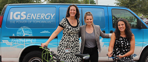 Employees with bikes in front of IGS Energy Van